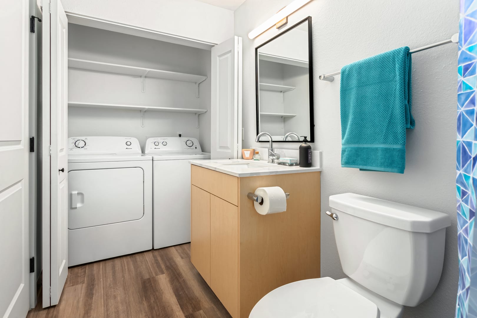 Bathroom and in-unit washer and dryer at Scout Kirkland